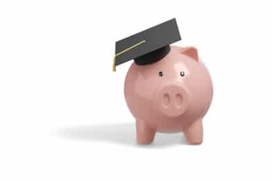 A piggybank with a graduation cap on, signifying cybersecurity degree tuition